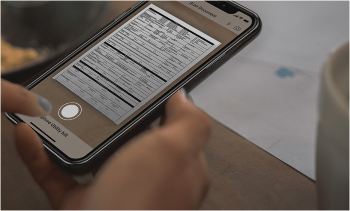 image of smart phone taking a picture of documents