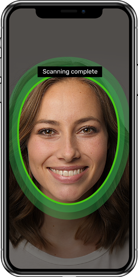 image of phone screen displaying woman's face smiling with green outlined circle. Text above circle reads: Scanning complete.