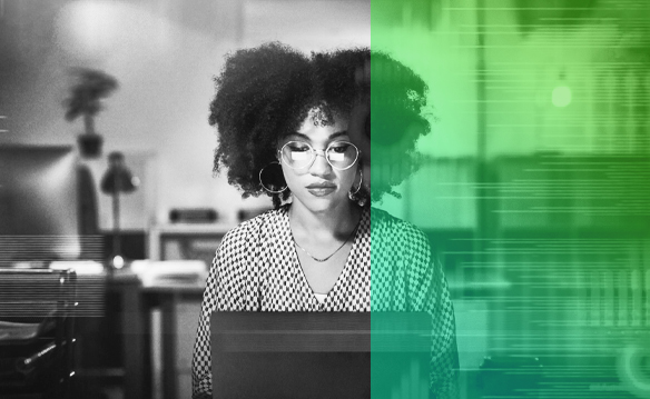 image of woman sitting at desk using a computer. The woman is wearing glasses. Right side of image has a green gradient overlay.