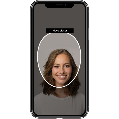 phone screen image of woman with short brown hair in frame. Phone screen displays an oval shape around face stating 