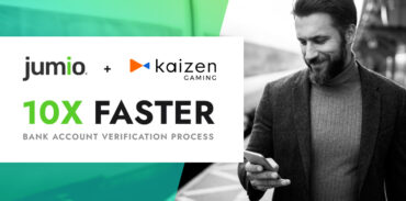 image of male holding phone. Jumio logo and Kaizen logo. Text on image reads: 10x faster. bank account verification process