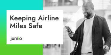 image of male holding phone. Screening scanning face. Image on text reads: Keeping Airlines Miles Safe.