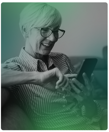 Woman with short hair and glasses smiling at her smartphone.