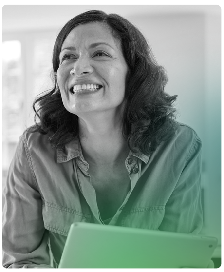 image of woman smiling sitting with her computer