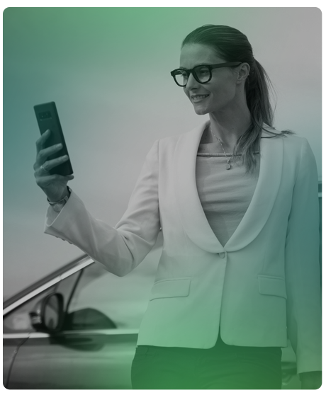 woman wearing glasses, holding a phone in her hand.