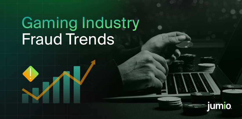 Person holding gaming chips in their left hand with a computer in the background. Text on image reads ‘Gaming Industry Fraud Trends.’