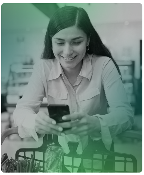 woman holding a phone smiling.