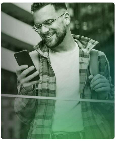 image of a man smiling at his smart device