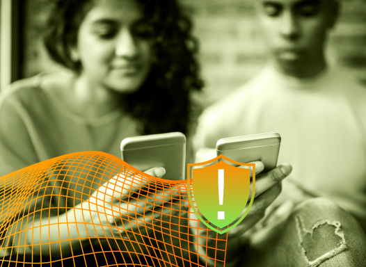 Sepia-toned photo of two teens looking at smartphones together, with a warning shield icon overlay